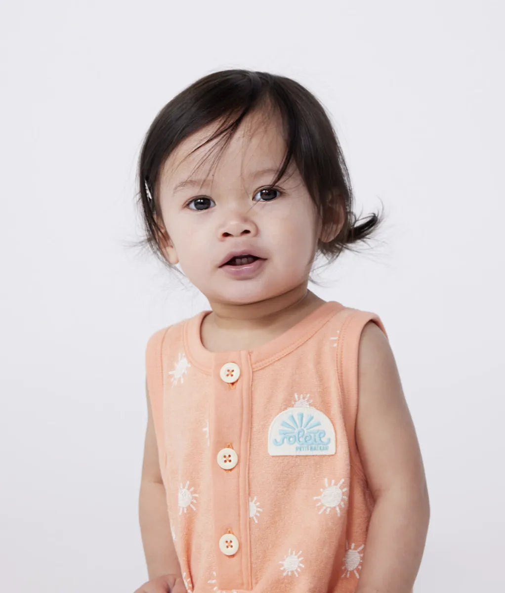 Petit Bateau Kort mouwloos babypakje van katoenen badstof met zonnetjesprint